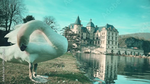 White Swan By Lake With Historic Chateau De Vizille and Museum of the French Revolution In Background, France