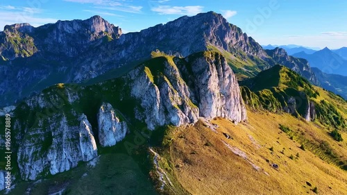 Aerial View Drone 4K Smooth Forward Flight Over Alpine Cliffs and Ridge with Dramatic Mountain Landscape and Golden Light in French Alps