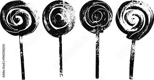 Four black and white grunge swirl lollipops on sticks in vintage silhouette