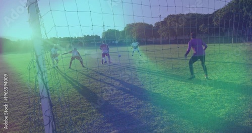 Sports striker receiving ball outside box and dribbling past defenders toward goal aiming low shot