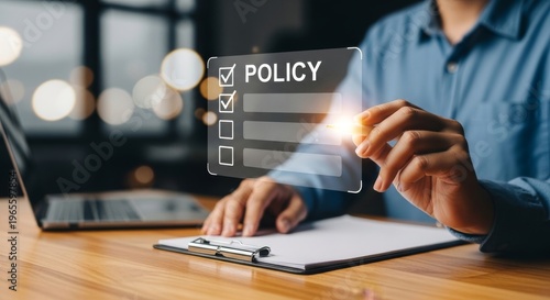 Person in Blue Shirt Interacting with Futuristic Policy Checklist Interface on Desk