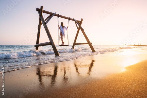 Happy young woman on wooden...