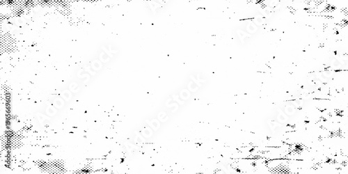 An abstract grunge background featuring black ink splashes and paint drops on a dirty paper surface with a weathered glass texture