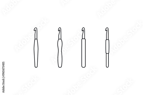 Set of four different crochet hooks with varying handle shapes and sizes