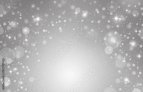 Soft silver bokeh background with glowing light and sparkling particles. Elegant and minimal holiday backdrop suitable for celebration, festive decoration, and luxury design.