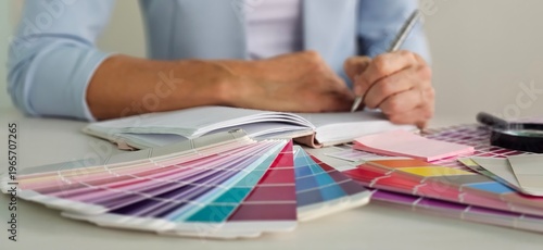 Obraz na płótnie Interior architect designer at workstation table choosing various color samples