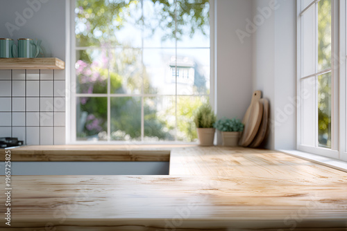 A sunlit kitchen scene with a wooden countertop in focus and a blurred backdrop of a window overlooking a garden