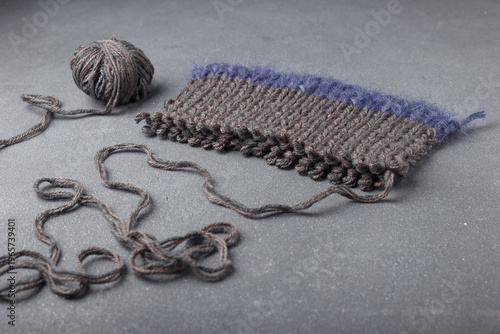 Принти на полотні Part of knitted mohair and acrylic garment on grey background