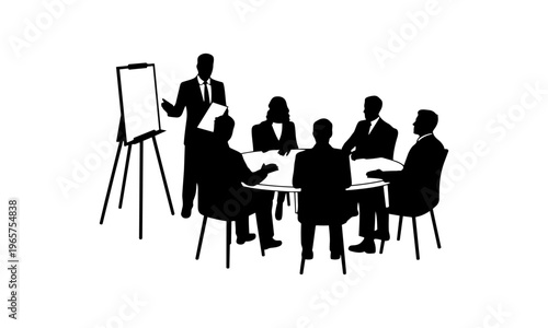 Business team meeting around a table with a presenter at an easel