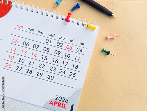 April 2026 calendar monthly planning schedule events appointment agenda on spiral-bound desk calendar