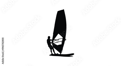 Windsurfer riding a wave with a striking dark silhouette
