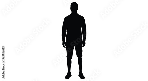 Full body view of a man in a dark striking silhouette