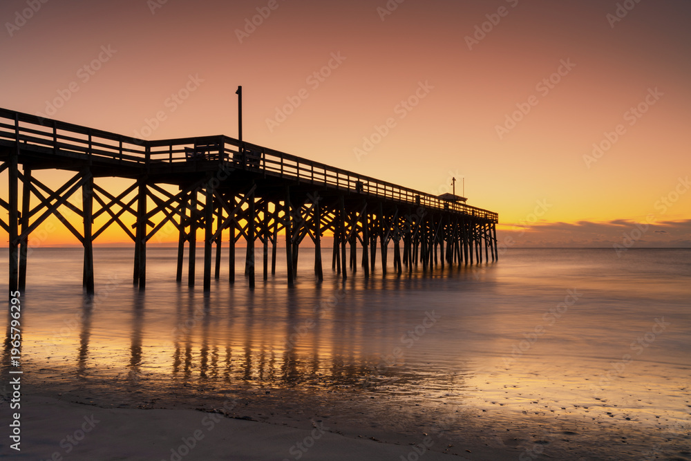 Fototapeta premium the rebuilt wooden pier at Palweys Island beach at sunrise