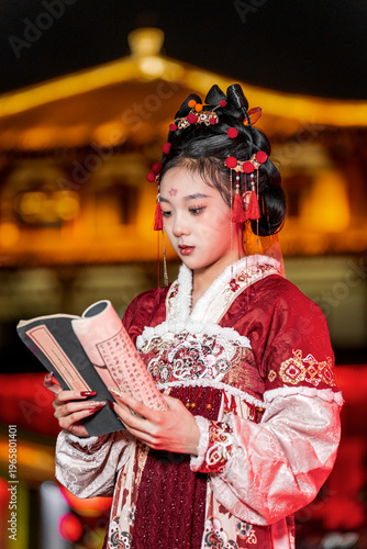 A woman dressed in Hanfu holding a scroll