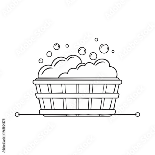 Wooden tub overflowing with bubbly soap suds and floating bubbles for bathing