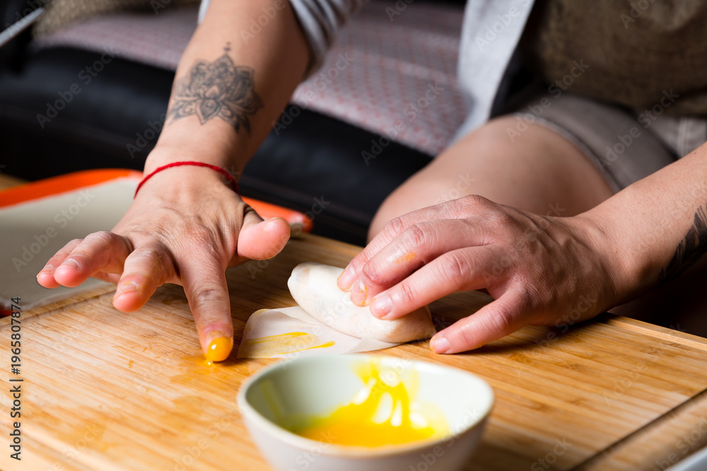 Obraz premium Preparing Vietnamese spring rolls on kitchen table, homemade cooking process