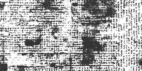 Distressed black and white textured background resembling aged newspaper print with ink smudges and faded text
