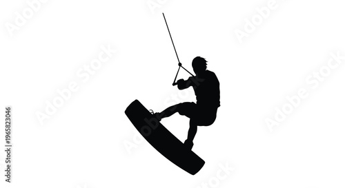 Wakeboarding athlete in action dynamically performing a trick silhouette