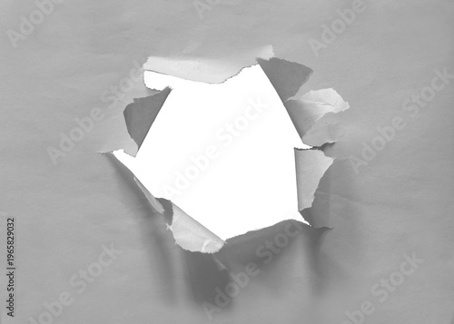 Torn hole in newsprint with paper texture isolated on transparent background.