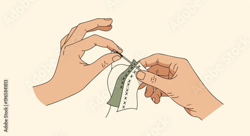 Close-up of two hands delicately cross-stitching on layered fabric