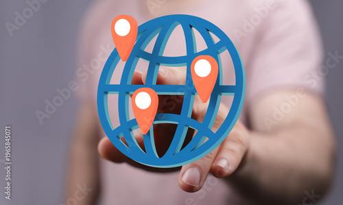 Hand touching a globe with ...