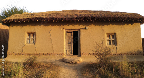 Traditional mud house with thatched roof, rustic clay cottage in rural village, ancient earthen architecture with wooden door and windows isolated PNG with Transparent Background