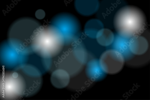 黒背景に浮かぶ水色の光　 幻想的な光のデザイン素材