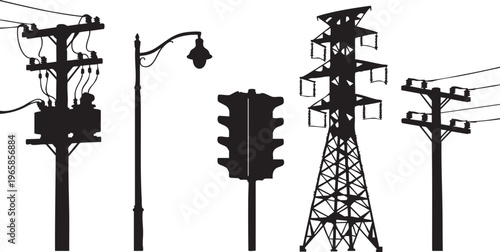 Black silhouettes of utility poles and traffic lights street lamps power lines transmission towers