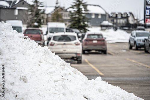 Pile of snow cleared after a snowstorm in parking lot