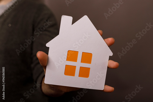 Hand holding a white cutout...