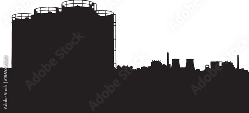 Silhouette of industrial cityscape with large cylindrical structure factory buildings
