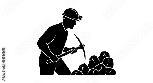 Silhouette of a Miner Working with Pickaxe in a Coal Mine.