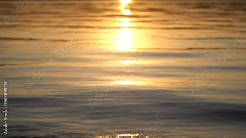 Beautiful sunset on the sea and birds flying in the colorful sky with clouds over the ocean, landscape background. and also the atmosphere of the sun on calm water with small waves