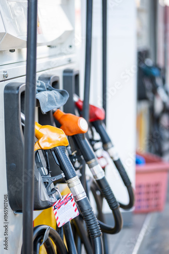 petrol pump and nozzles at gas station on the street in daylight