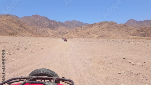 Driving a quad bike in the desert near Dahab, Egypt
