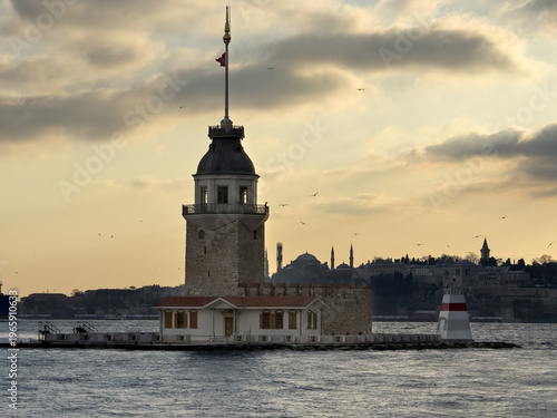 View of the Maiden's Tower stands gracefully amidst the water, a beacon of history under a pastel sky, Istanbul, Istanbul, Turkey.