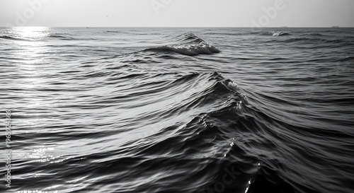 Monochrome Ocean Waves Under Sunlight.