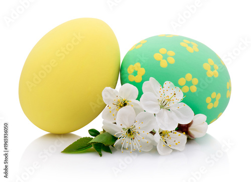 Two handmade Easter eggs yellow and green isolated on white background