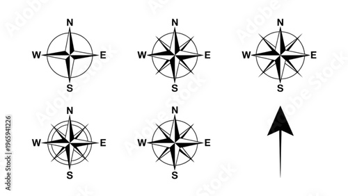 Six compass roses with directional arrows and a single upward-pointing arrow Vector