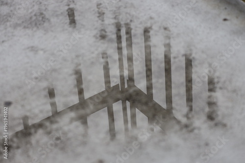 Photography brown iron railing viewed through frosty window glass