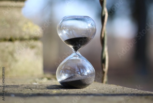 Old park and hourglass time is passing concept hurry up be in time old and modern 