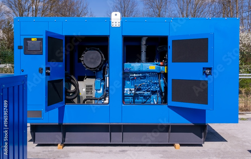 Fotografie Industrial diesel generator in blue soundproof enclosure with open doors, backup power supply unit, emergency electric energy equipment