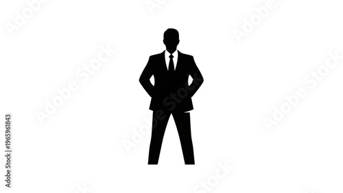 Silhouette of a confident businessman in a suit and tie standing with hands on hips