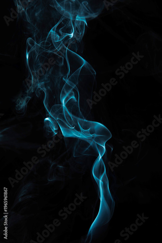 Abstract blue Smoke Swirling on Black Background