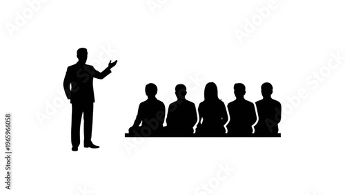 Silhouette of a man presenting to a group of people sitting