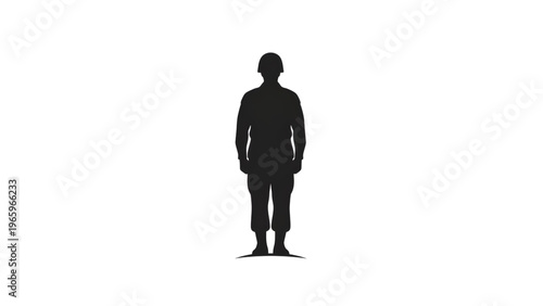 Silhouette of a man wearing a hard hat standing alone