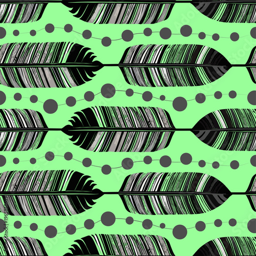 simple seamless pattern of black and gray bird feathers and beads on a green background, texture