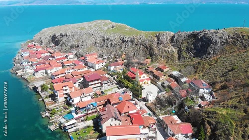 Village of Lin on the Rocky Peninsula Edge Along the Beautiful Shoreline of Lake Ohrid surrounded by emerald calm waters