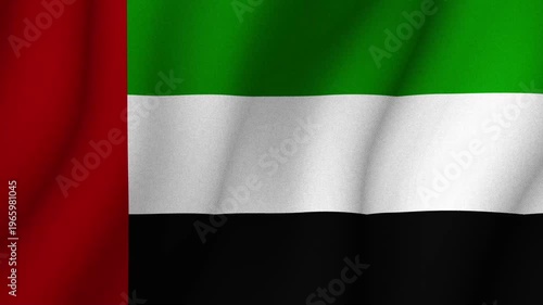Flag of United Arab Emirates waving in wind with red green white and black colors. National identity patriotism and country symbol concept.