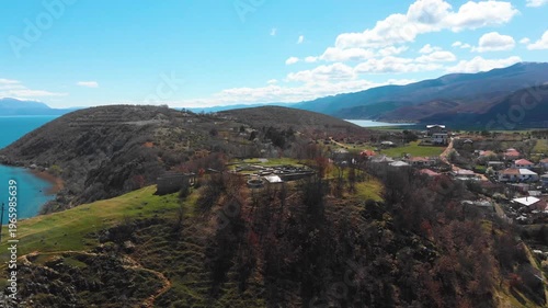 Village of Lin on the Rocky Peninsula Edge Along the Beautiful Shoreline of Lake Ohrid surrounded by emerald calm waters